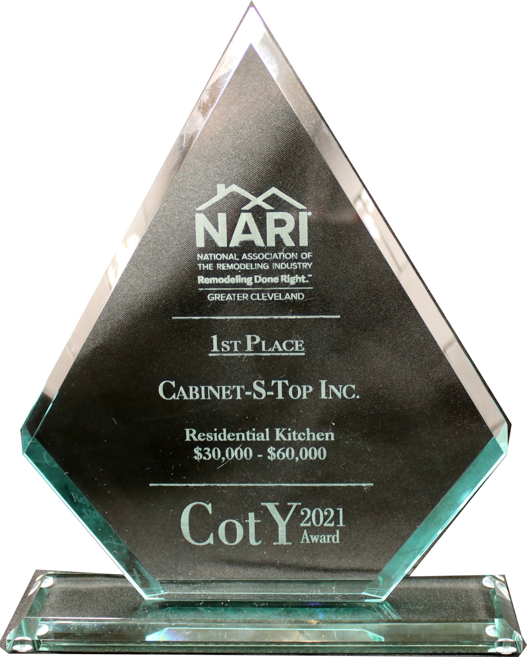 A trophy that says ' nari 1st place cabinet s-top inc ' on it