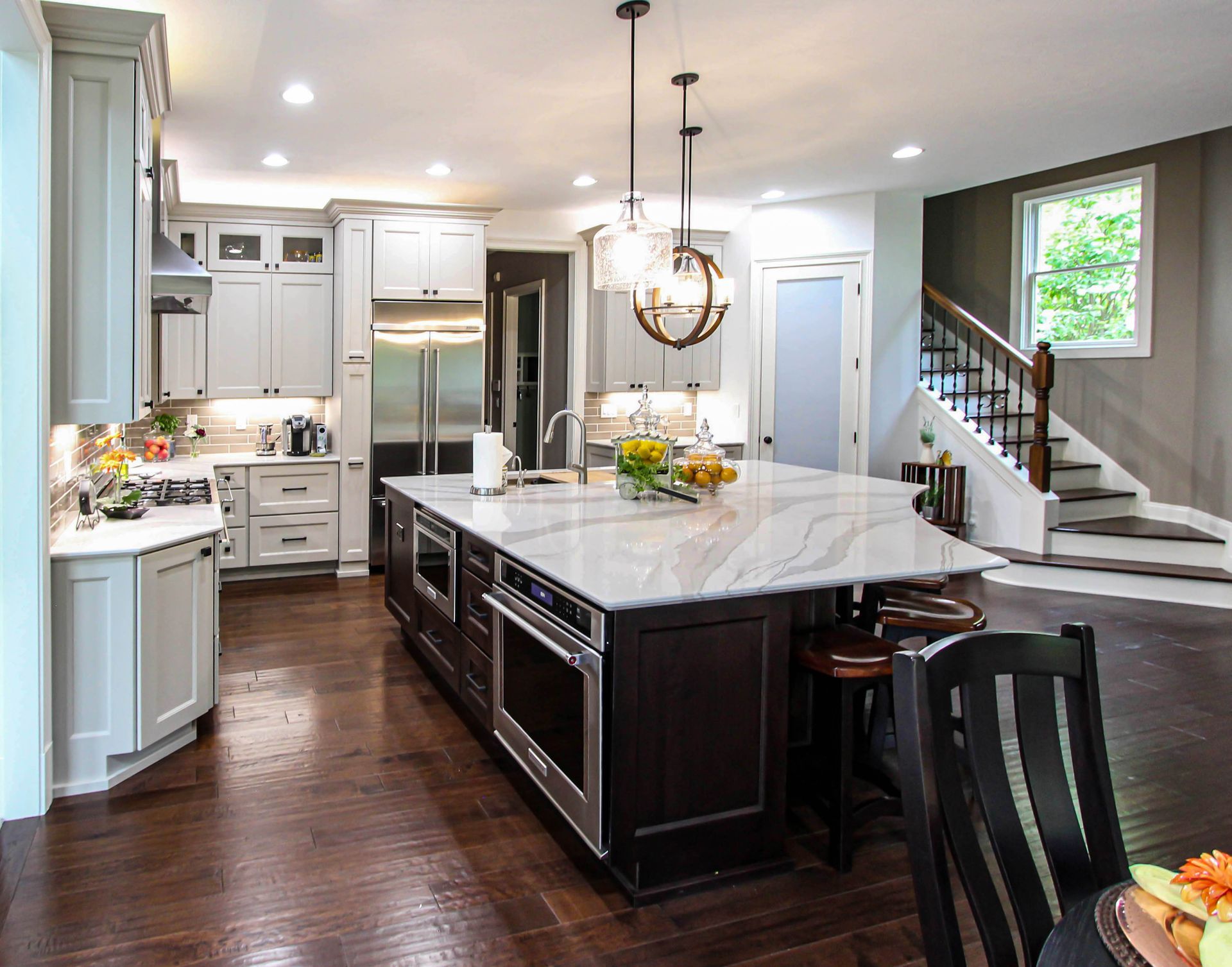 There is a large island in the middle of the kitchen.