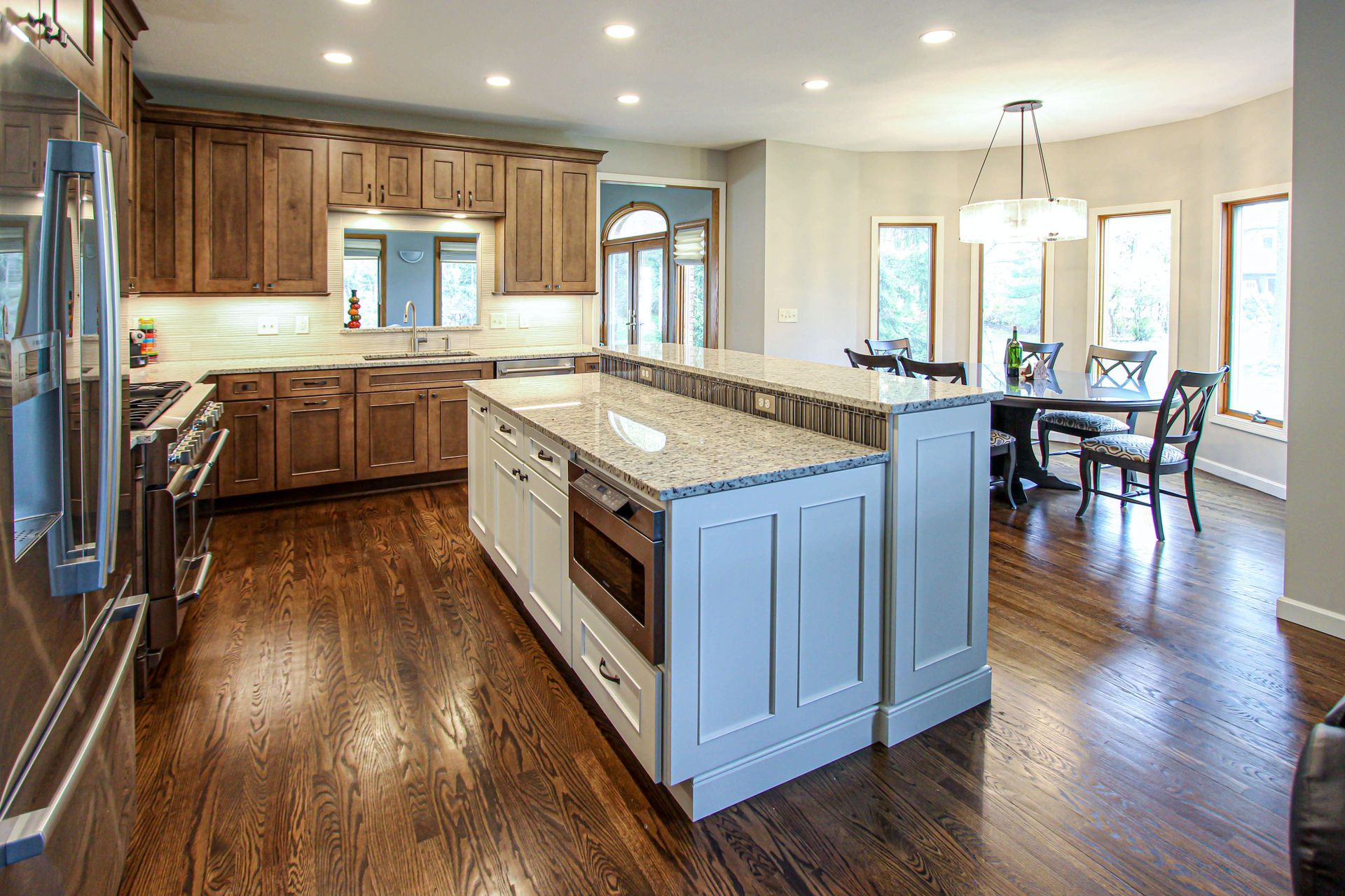 There is a large island in the middle of the kitchen.