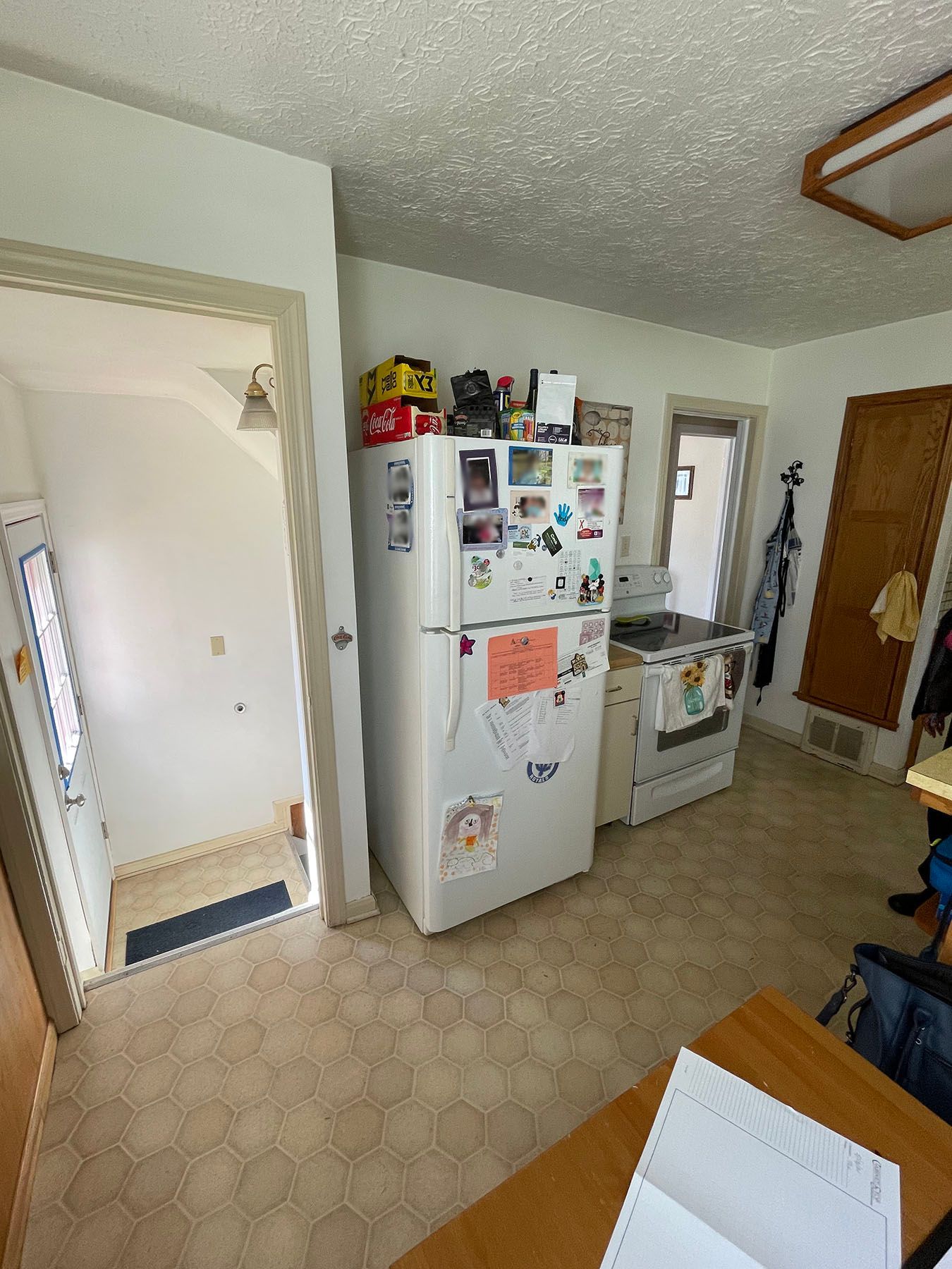A kitchen with a refrigerator , stove , and sink.