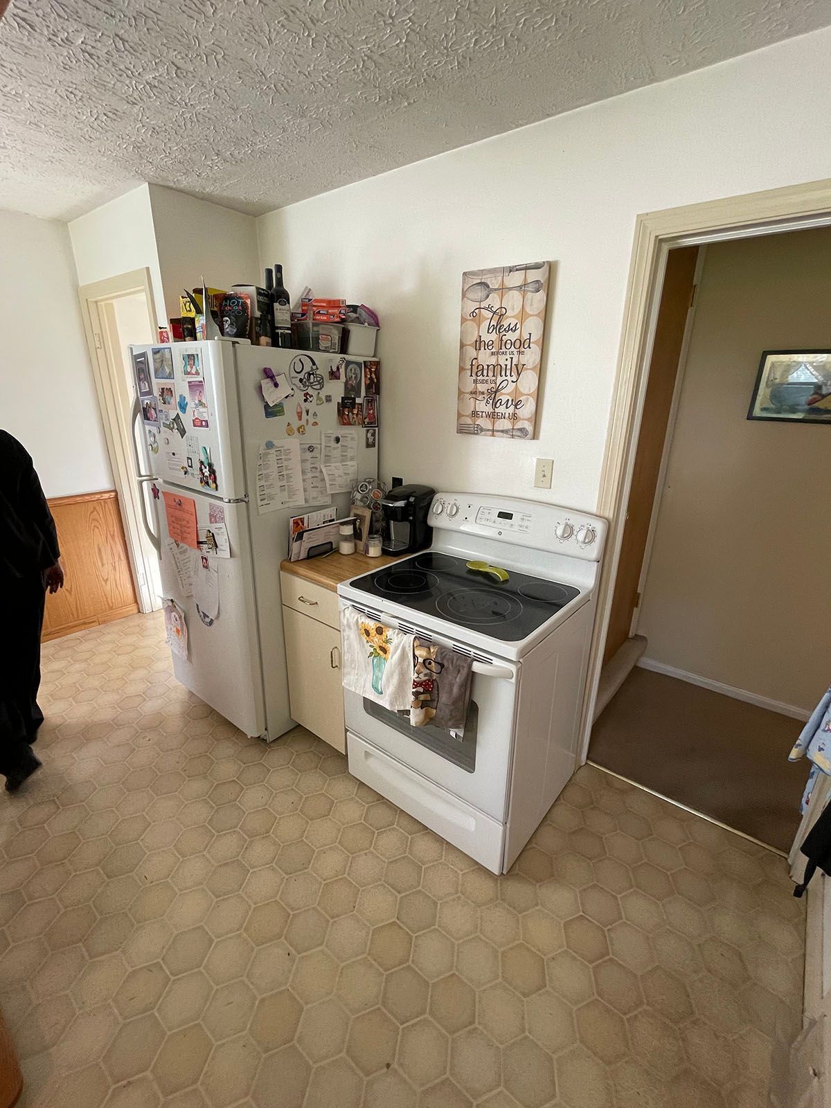 A kitchen with a refrigerator , stove , and sink.