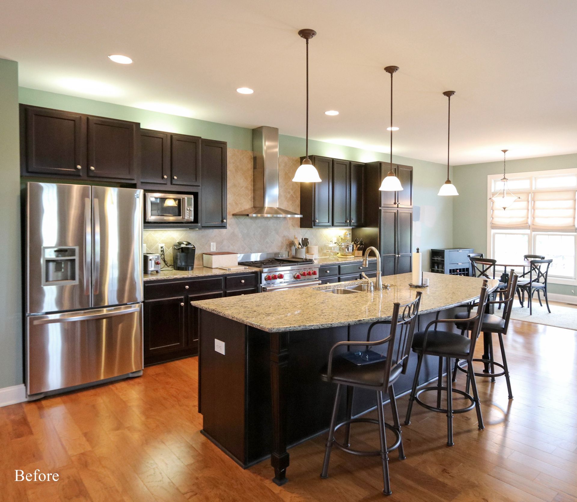 A kitchen with stainless steel appliances and granite counter tops