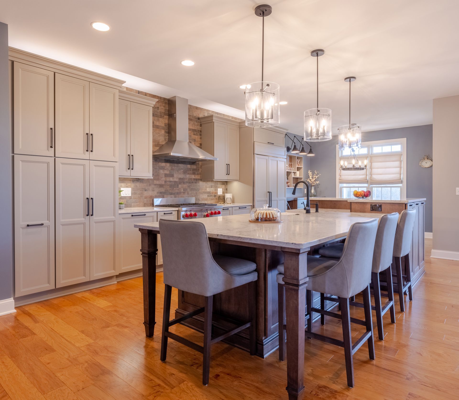 There is a large island in the middle of the kitchen.