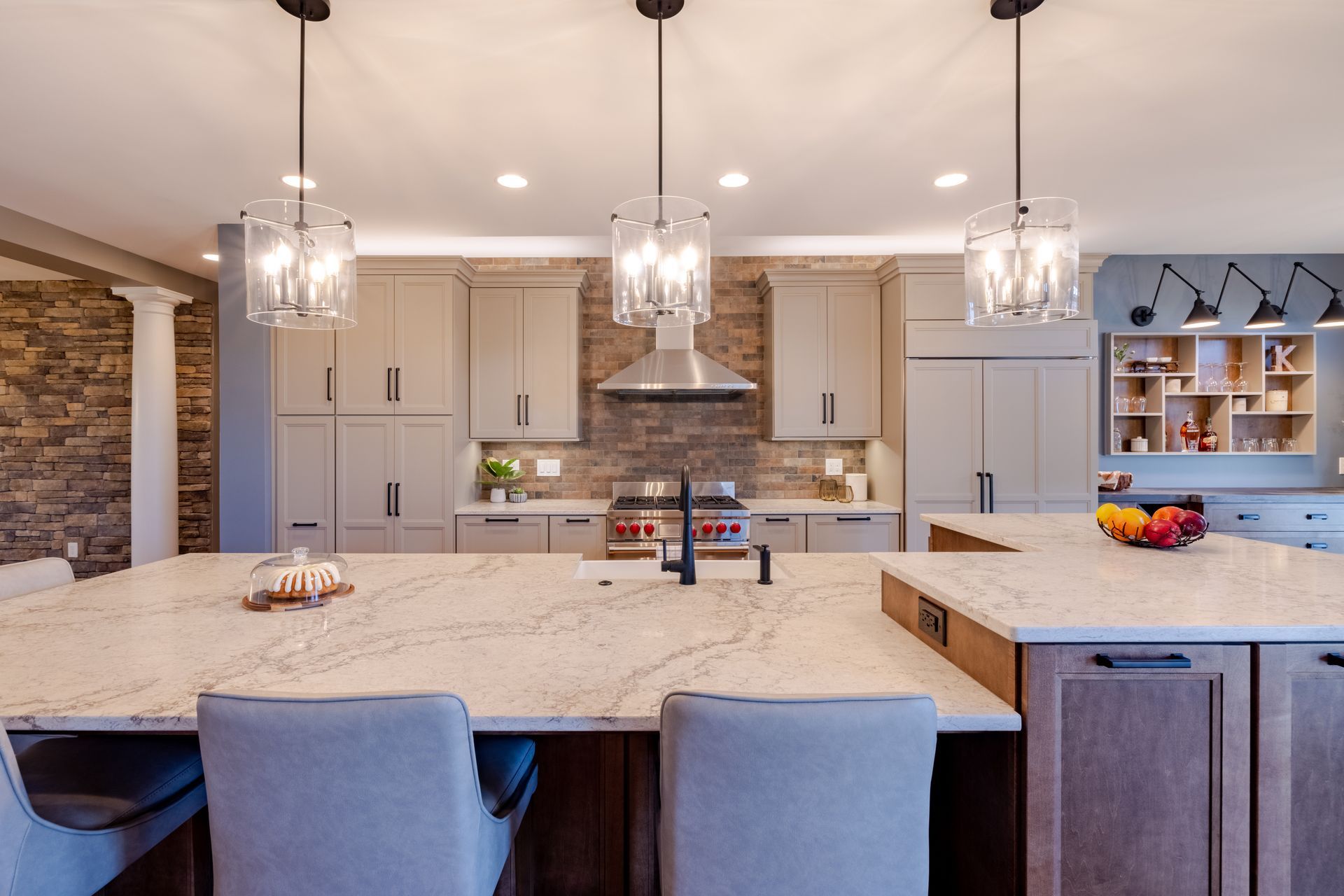 There is a large island in the middle of the kitchen.