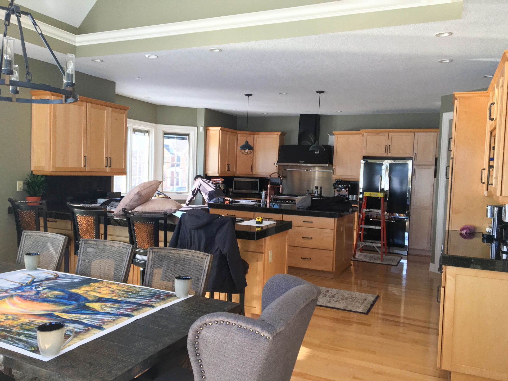 A kitchen with a table and chairs in it