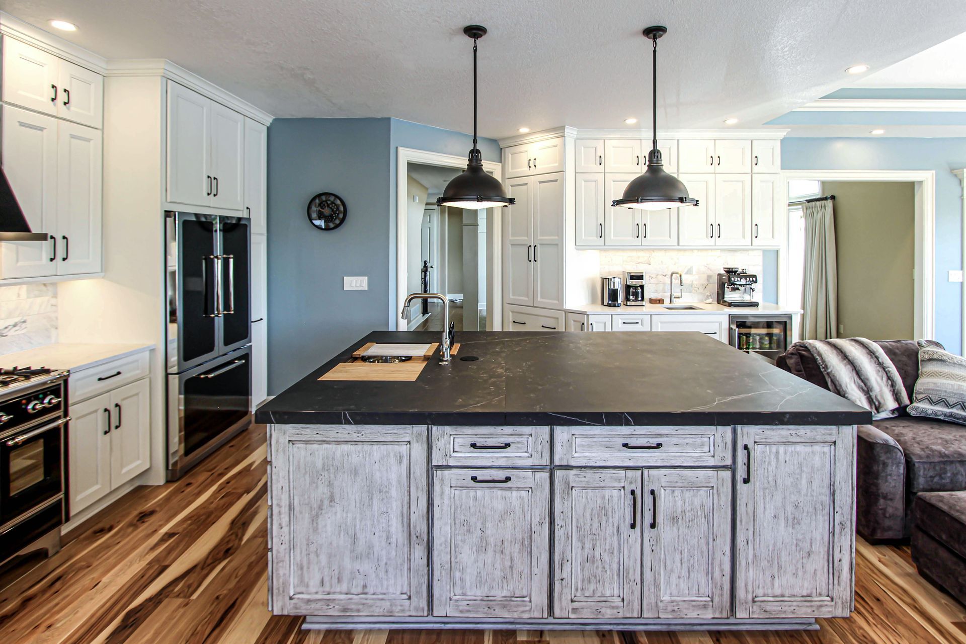 There is a large island in the middle of the kitchen.