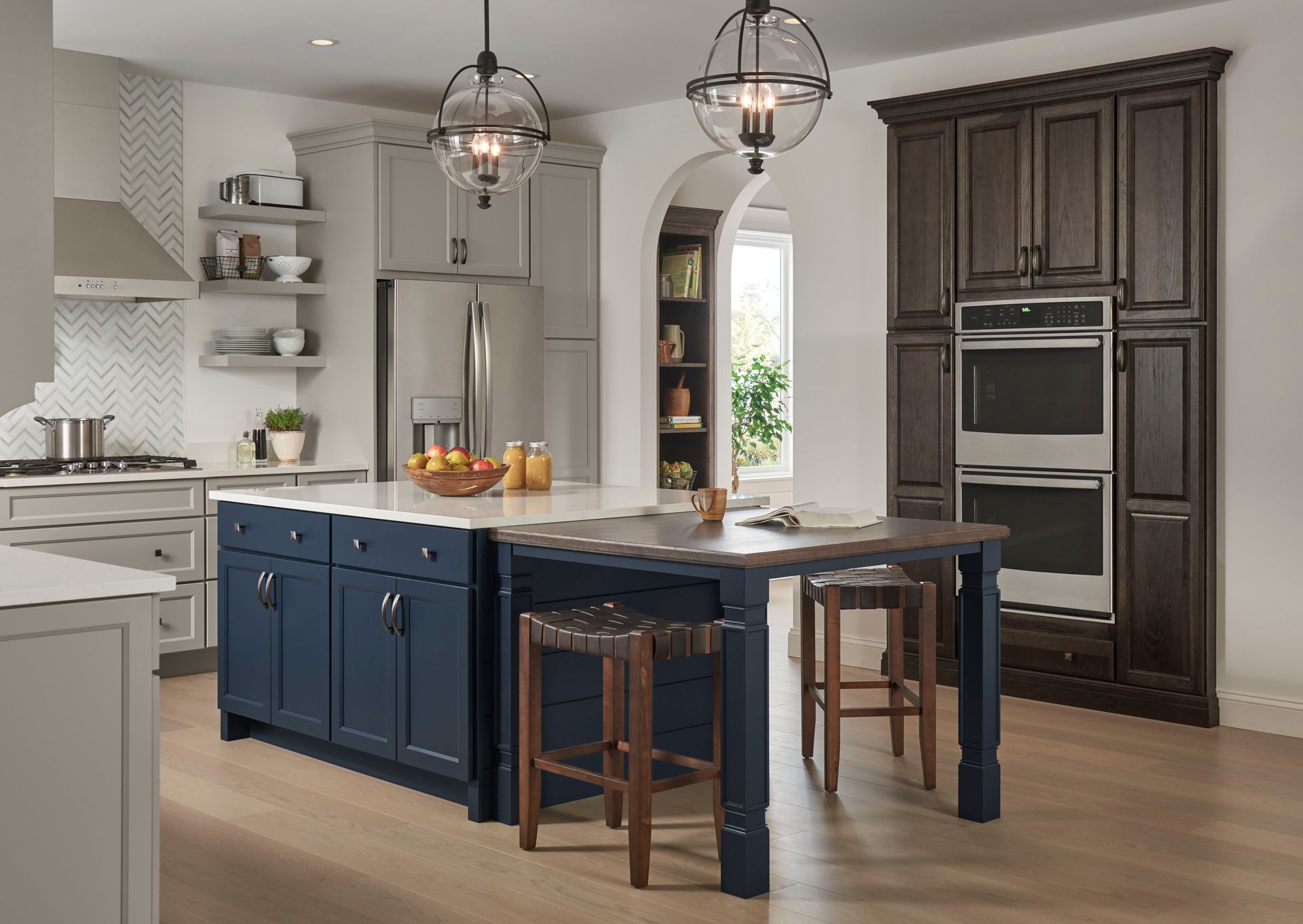 A kitchen with a large island in the middle of the room.