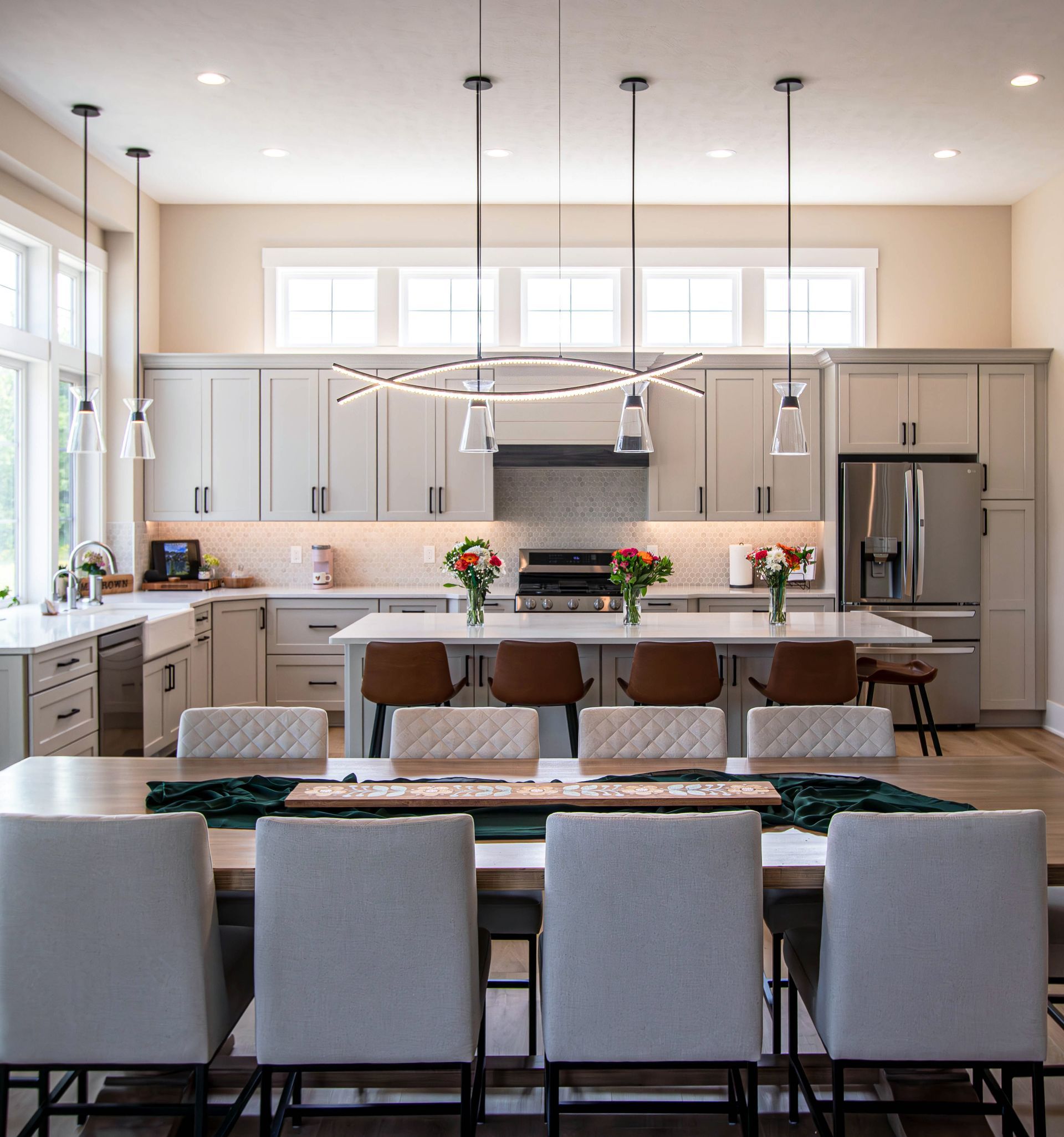 A kitchen with a table and chairs in it
