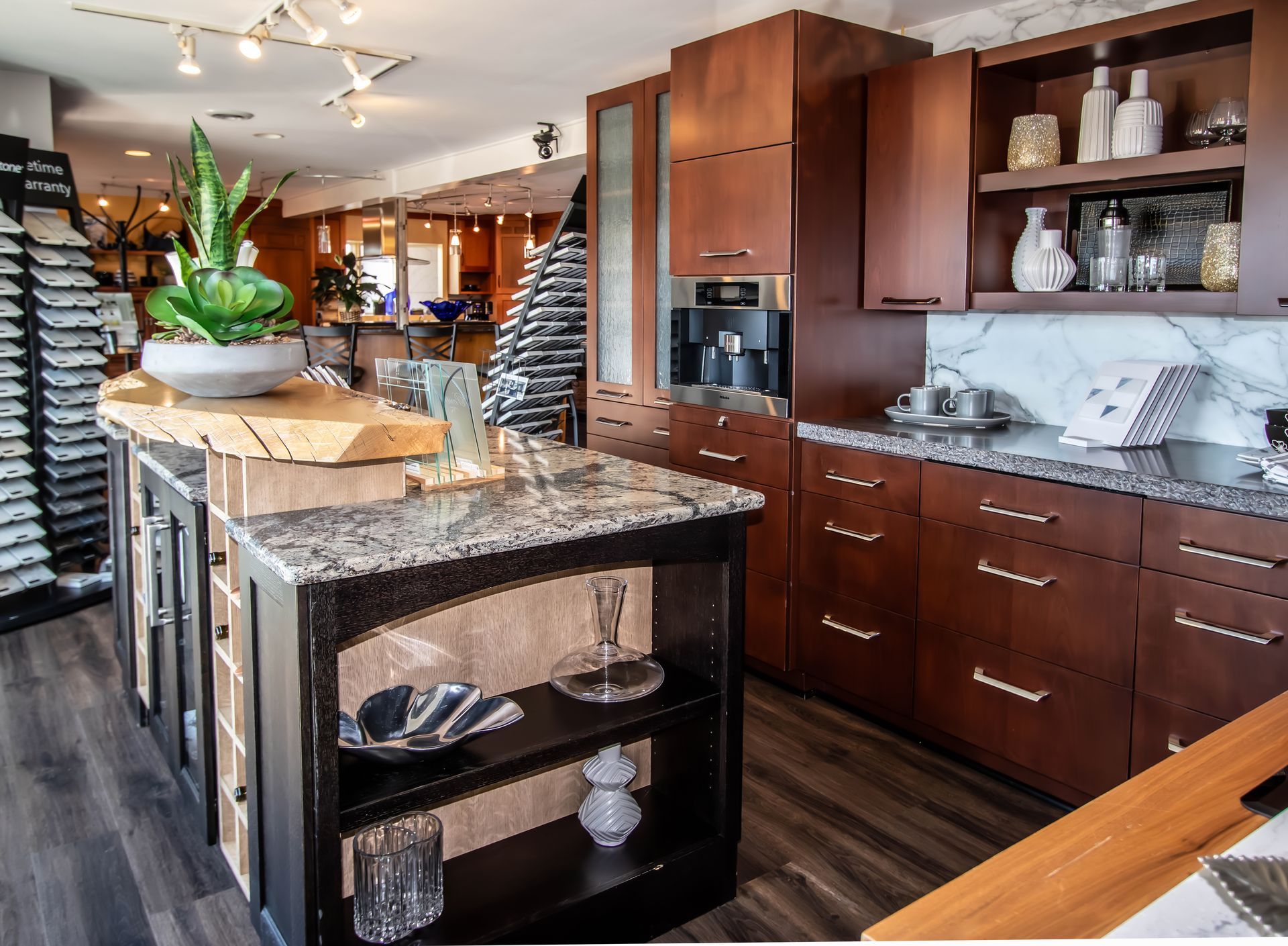 A kitchen with wooden cabinets and granite counter tops