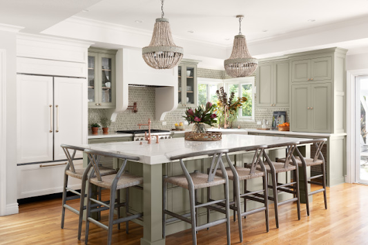 A kitchen with a large island and stools