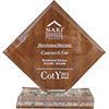 A wooden plaque is sitting on top of a marble base.