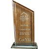 A wooden trophy with a glass base on a white background.