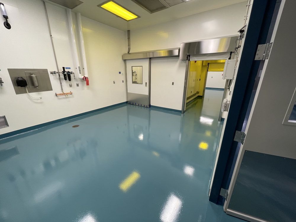 Seamless resinous floor with troweled cove base in a pharmaceutical cleanroom near Alpharetta, GA