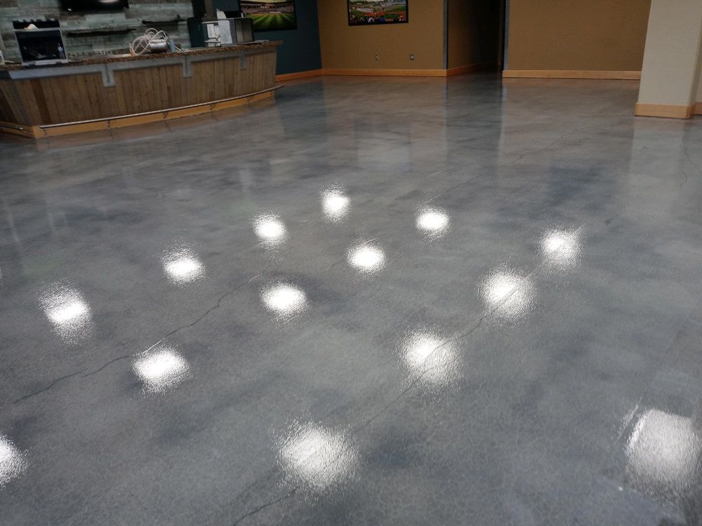 High-gloss polished concrete floor at a sports and food facility in Buford, GA