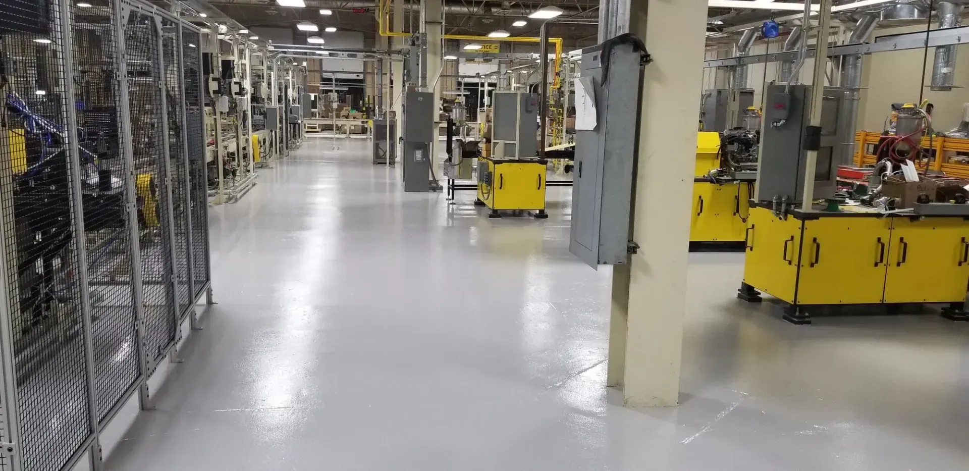 A large warehouse filled with lots of machinery and equipment.