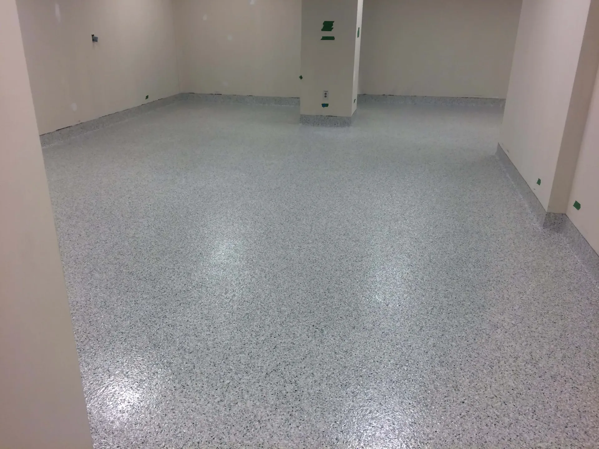 A large room with a white floor and white walls.