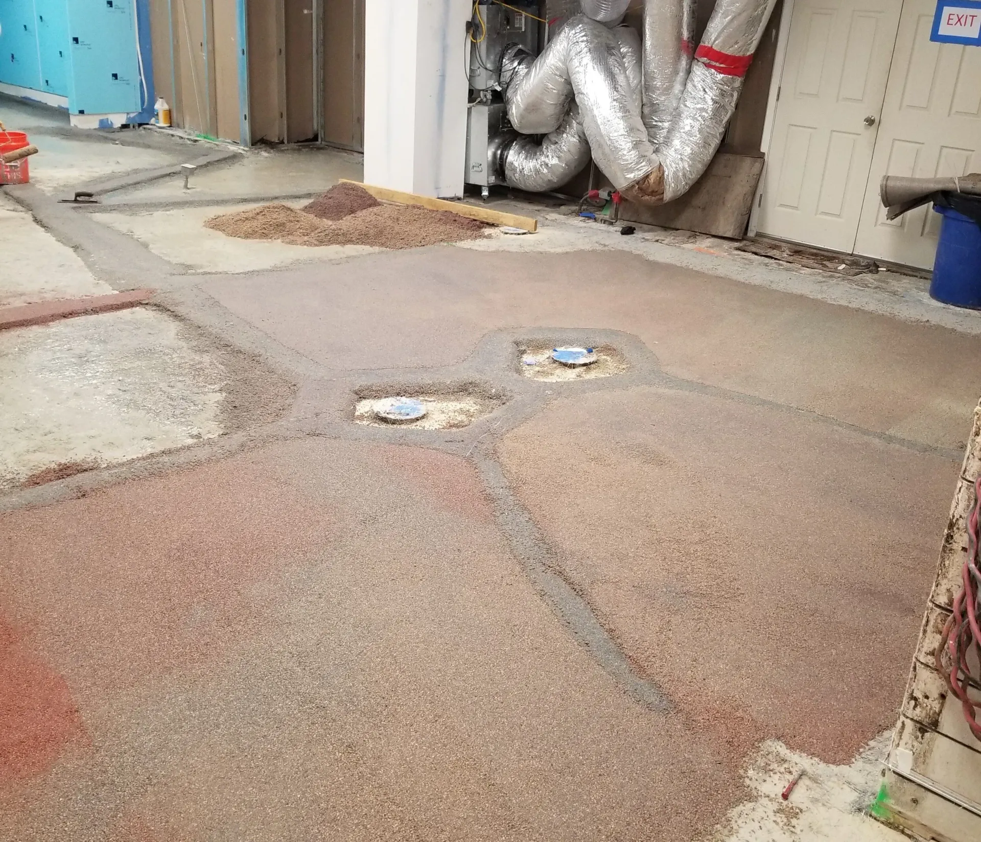 A concrete floor with a lot of holes in it