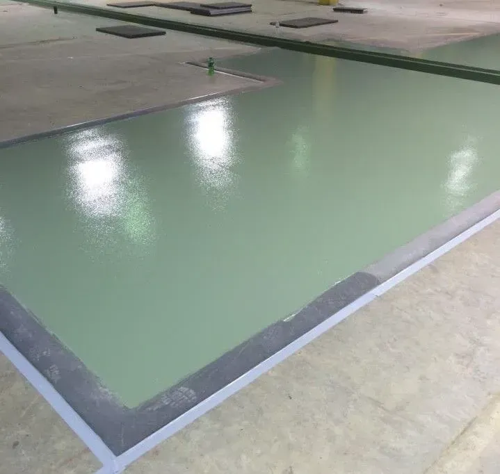A green concrete floor with a white border
