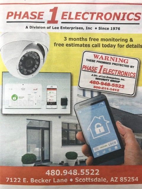 Phase 1 Electronics ad for home security with camera, control panel, smartphone app, and storefront details