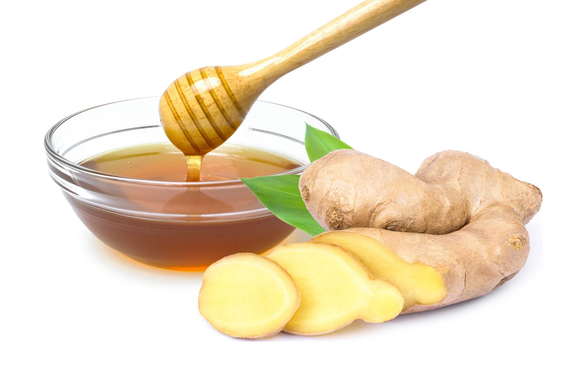 Ginger root, sliced ginger, and honey dipper with honey in a bowl