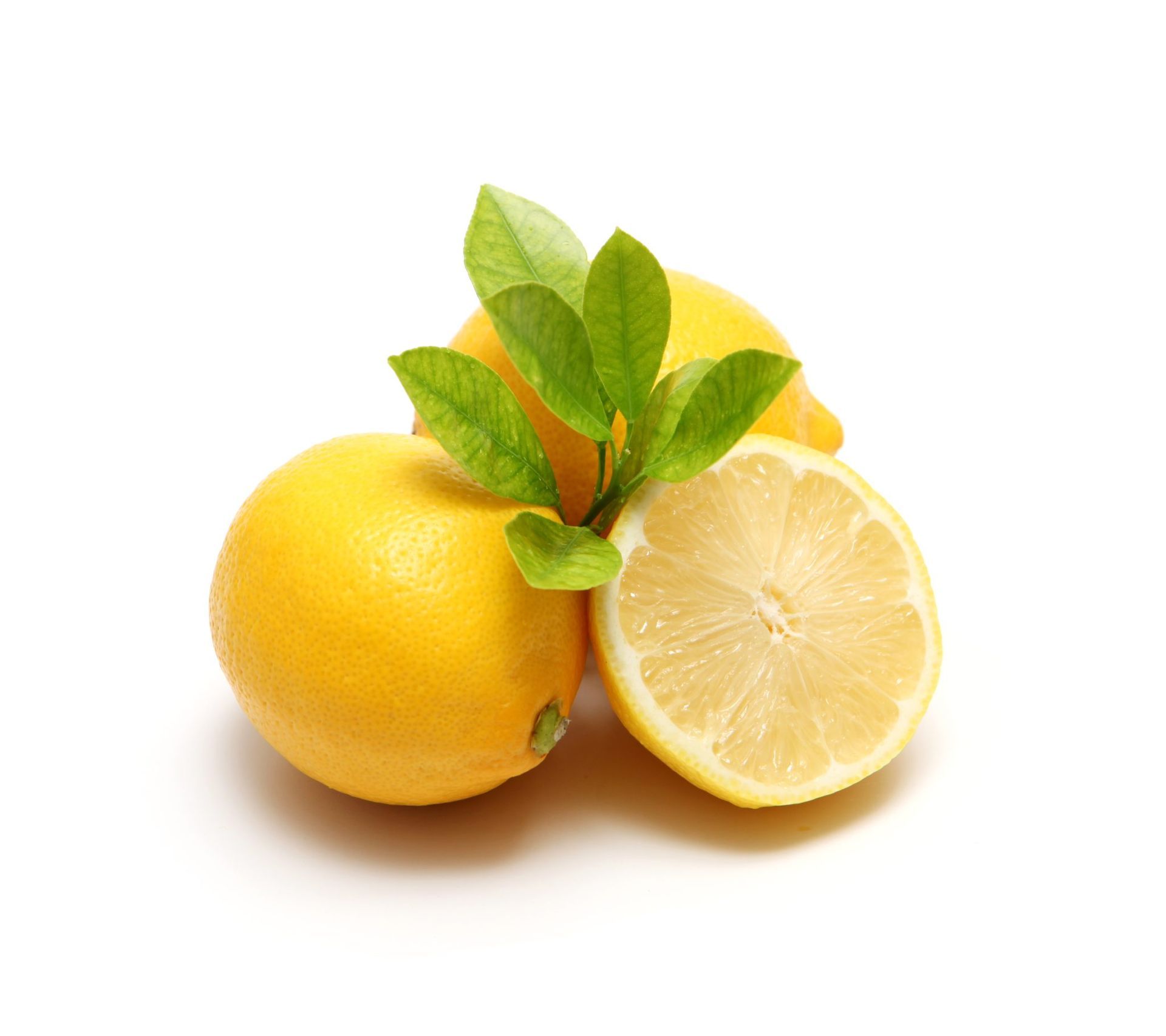Yellow lemons with green leaves