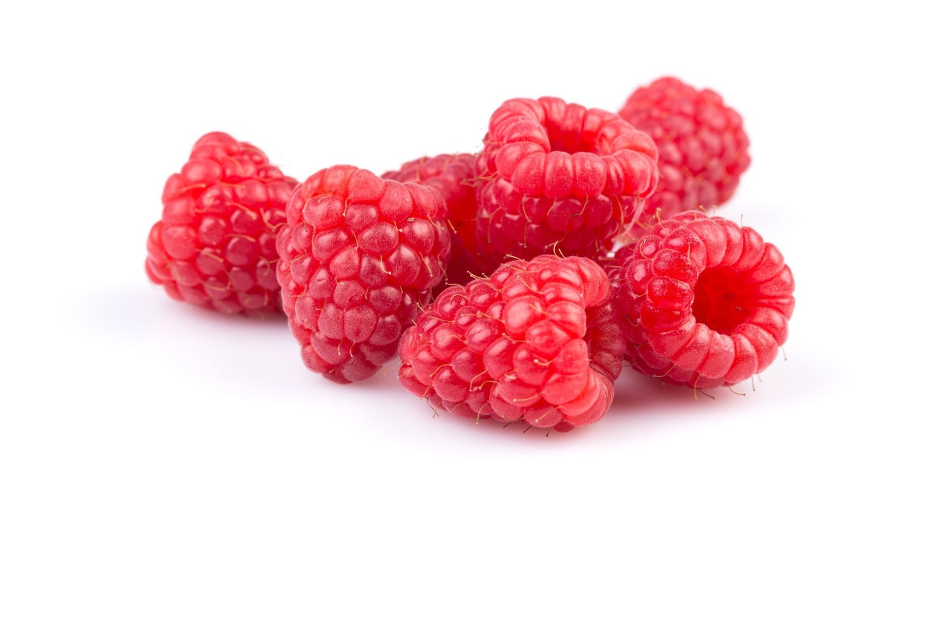 A pile of fresh red raspberries