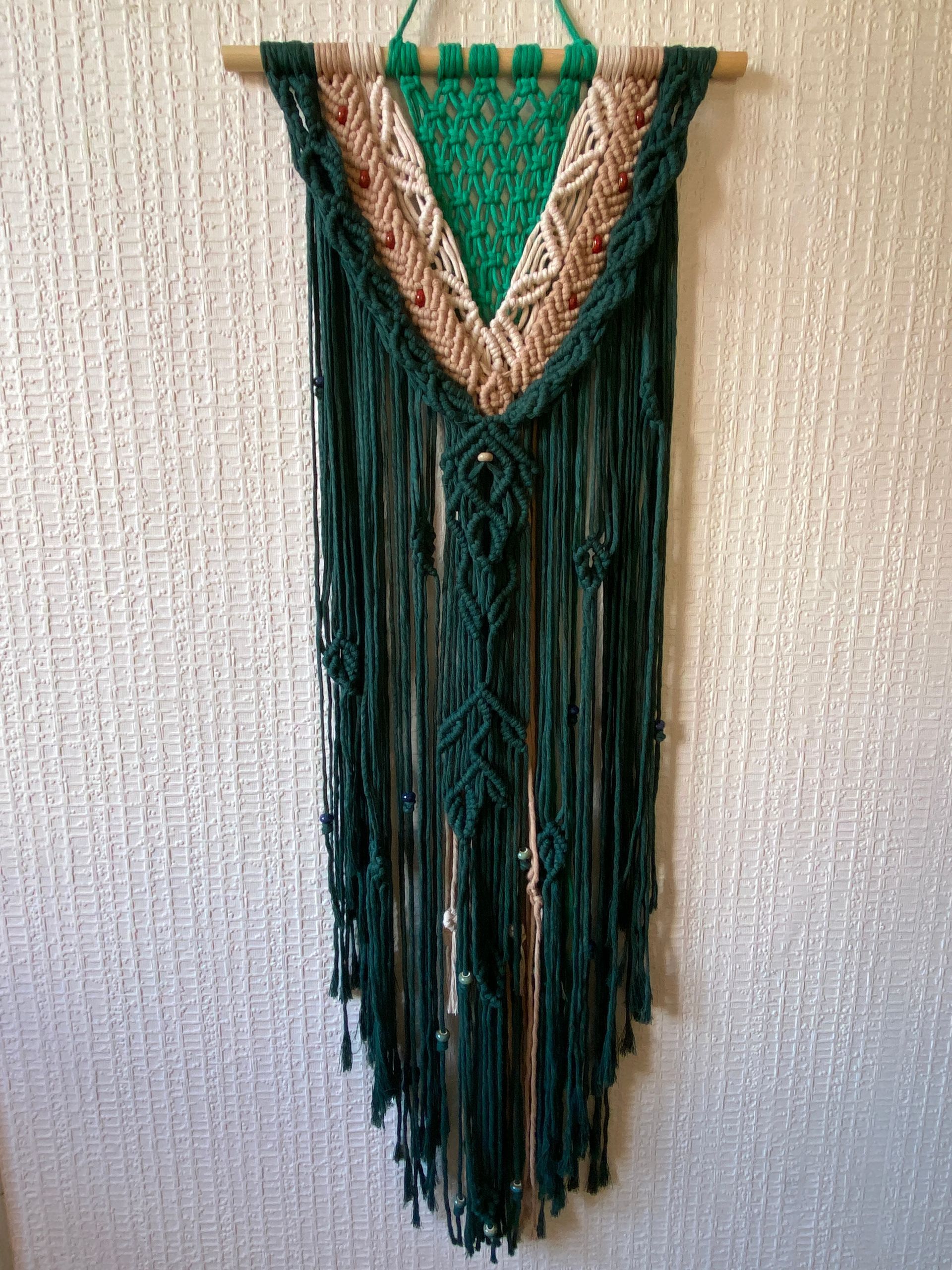 A wall hanging in 4mm cotton cord. The style is intended to emulate nature with leaves and berries. Made for Karen.