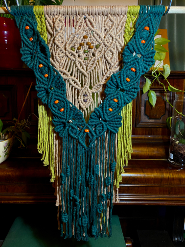 Wall hanging made for Rosemary. Embellished with ceramic beads to form a tree shape, a yoni, and berries,