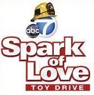 ABC 7 Spark of Love Toy Drive logo in red and white with a toy donation graphic and ABC7 emblem