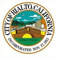 Seal of the City of Rialto, California, with a train, mountains, and sky in a circular emblem