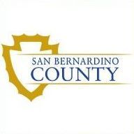 San Bernardino County logo with gold shield outline and blue text on white background