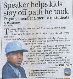 Newspaper article with photo of a man in a blue cap about helping kids stay off the path he took