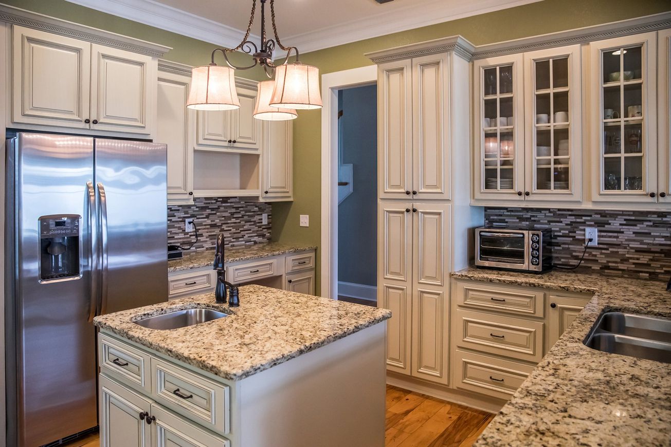 square shaped green kitchen cream colored