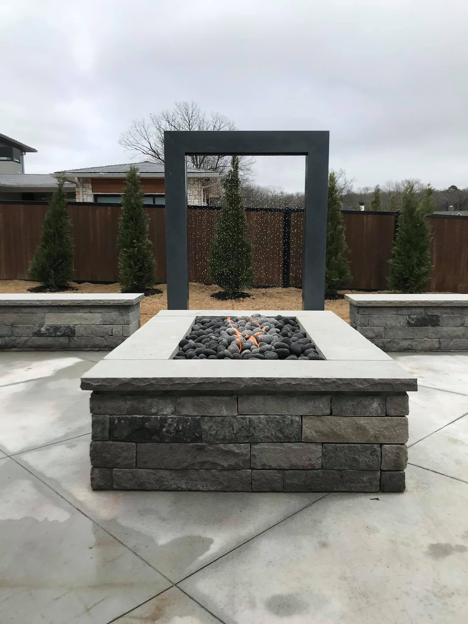There is a fire pit in the middle of the patio.