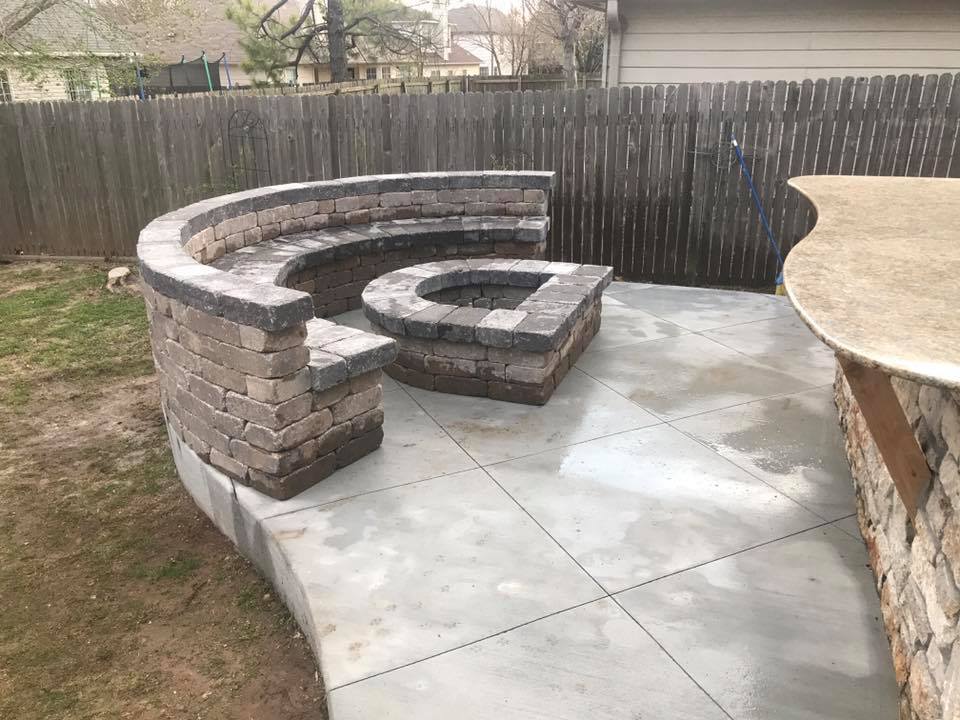 There is a fire pit in the middle of the patio.