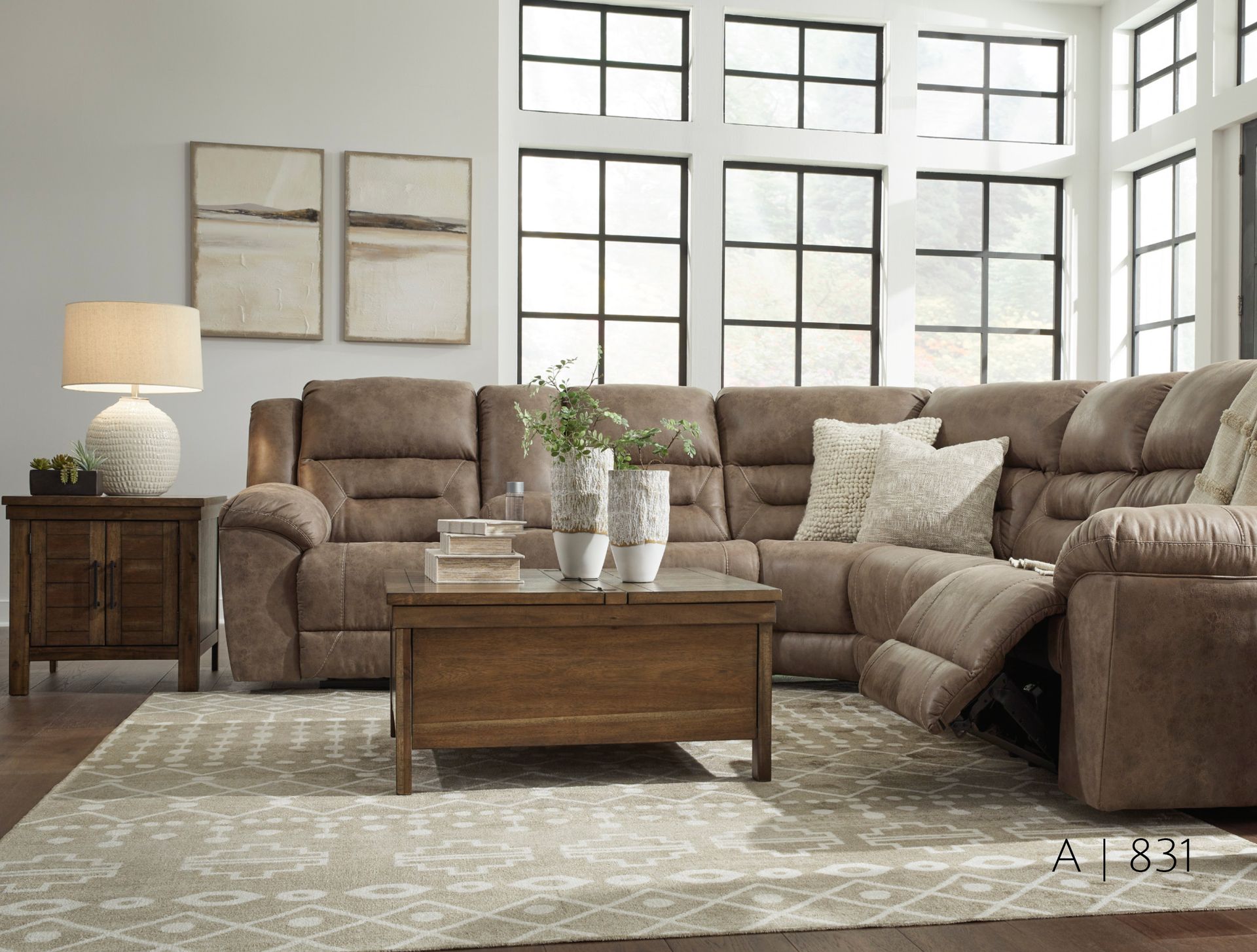 Brown sectional sofa with recliner, coffee table, and area rug
