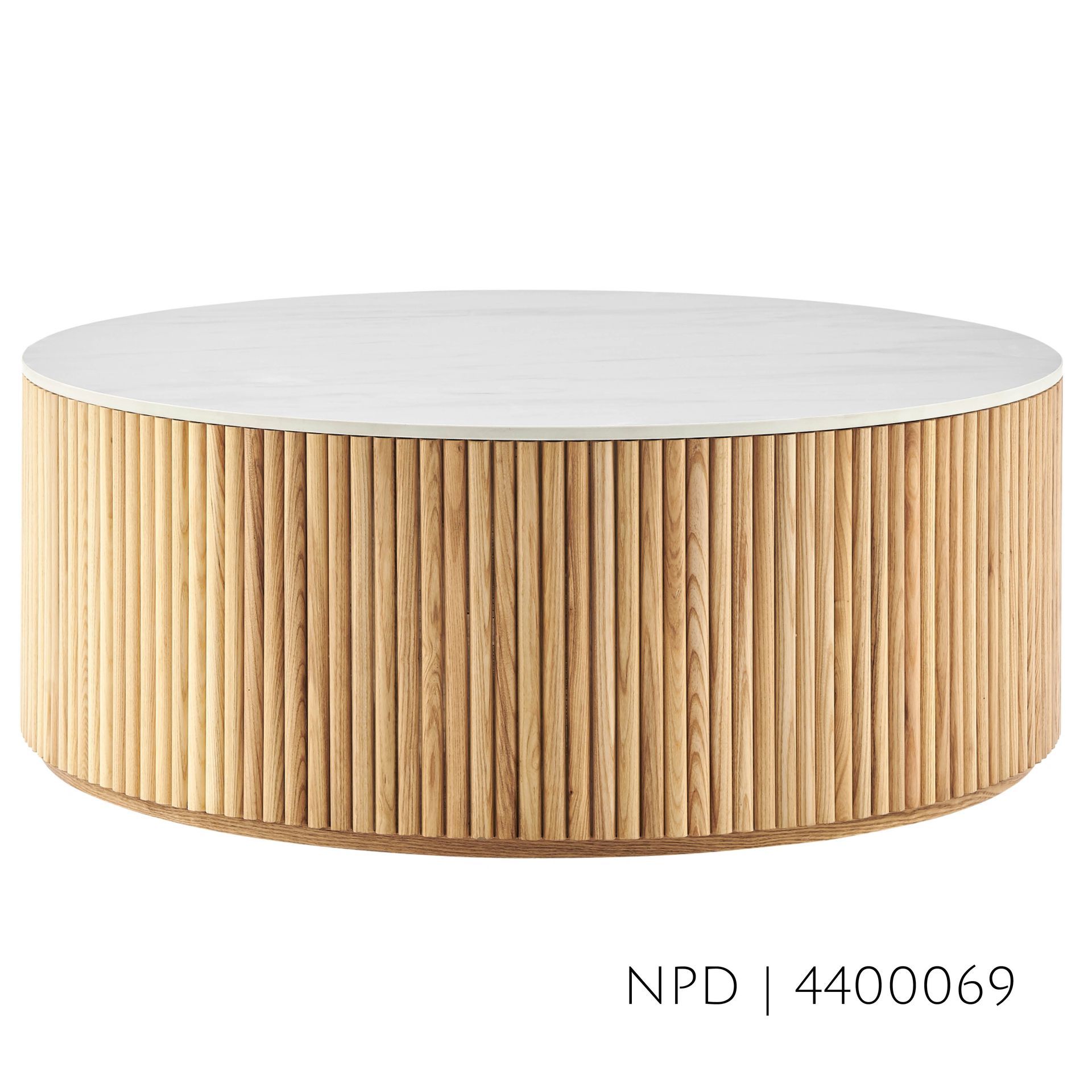 Round coffee table with a white top and wood slat sides.