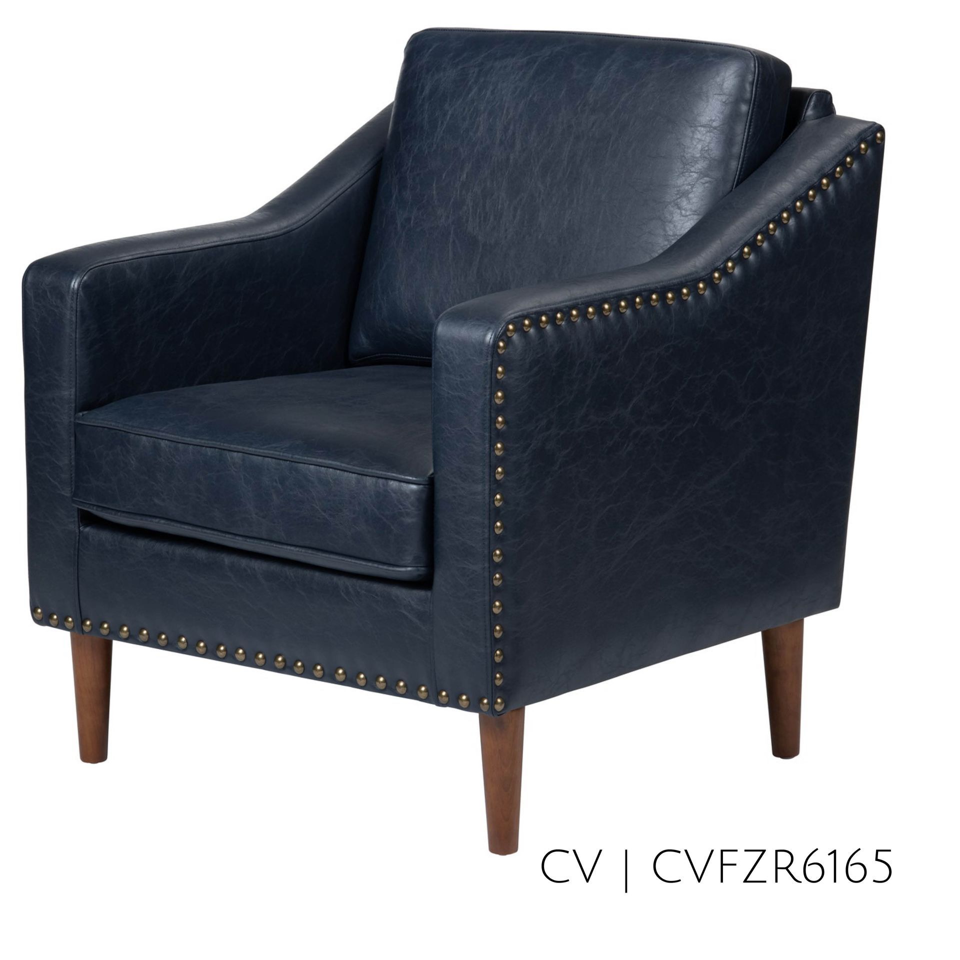 Navy blue armchair with wood legs and nailhead trim.