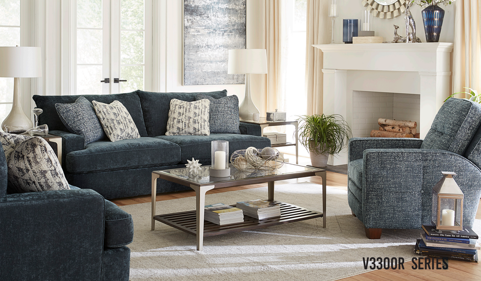 Living room with blue sofa, armchairs, coffee table
