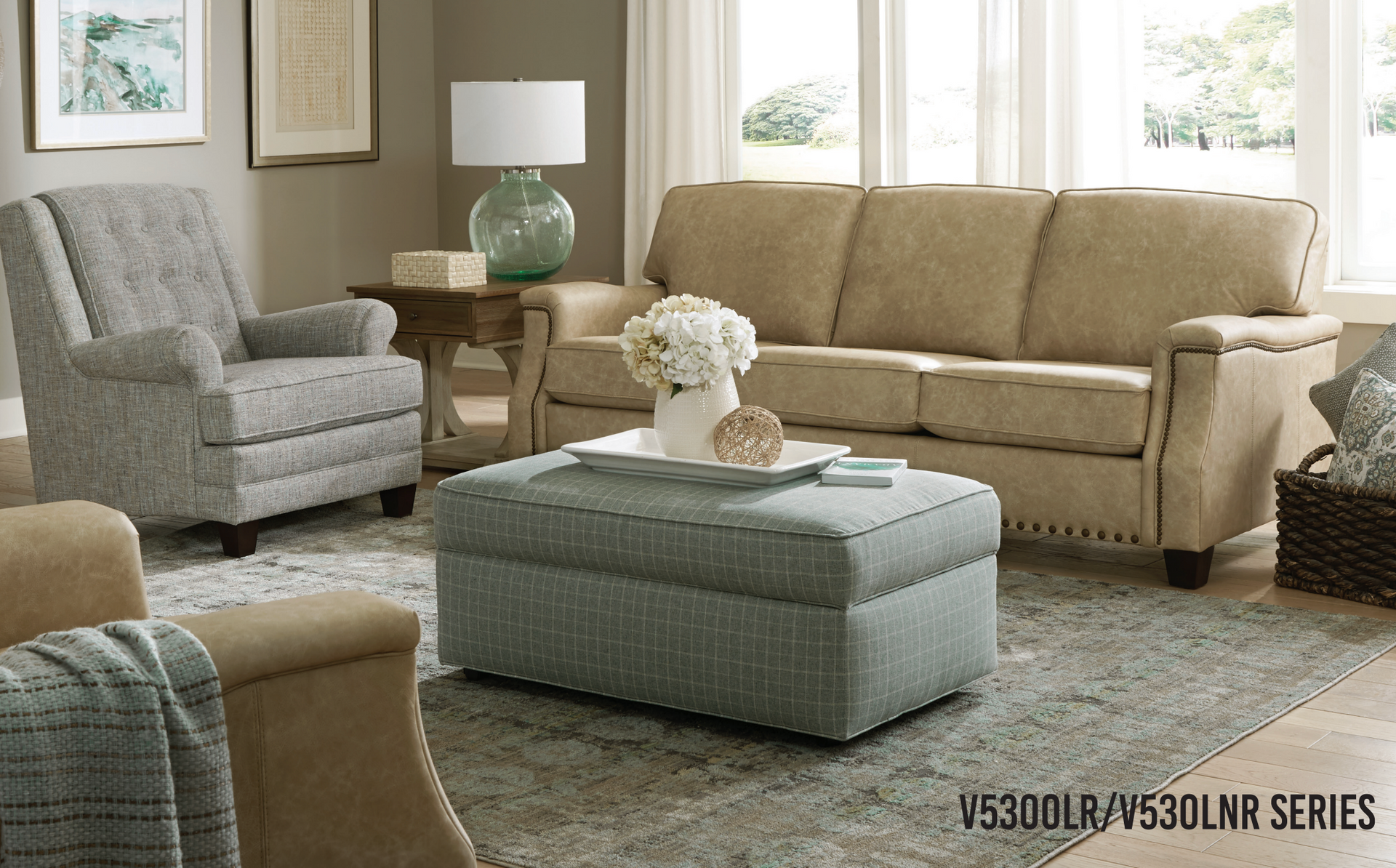 sofa, armchair, ottoman, and rug.