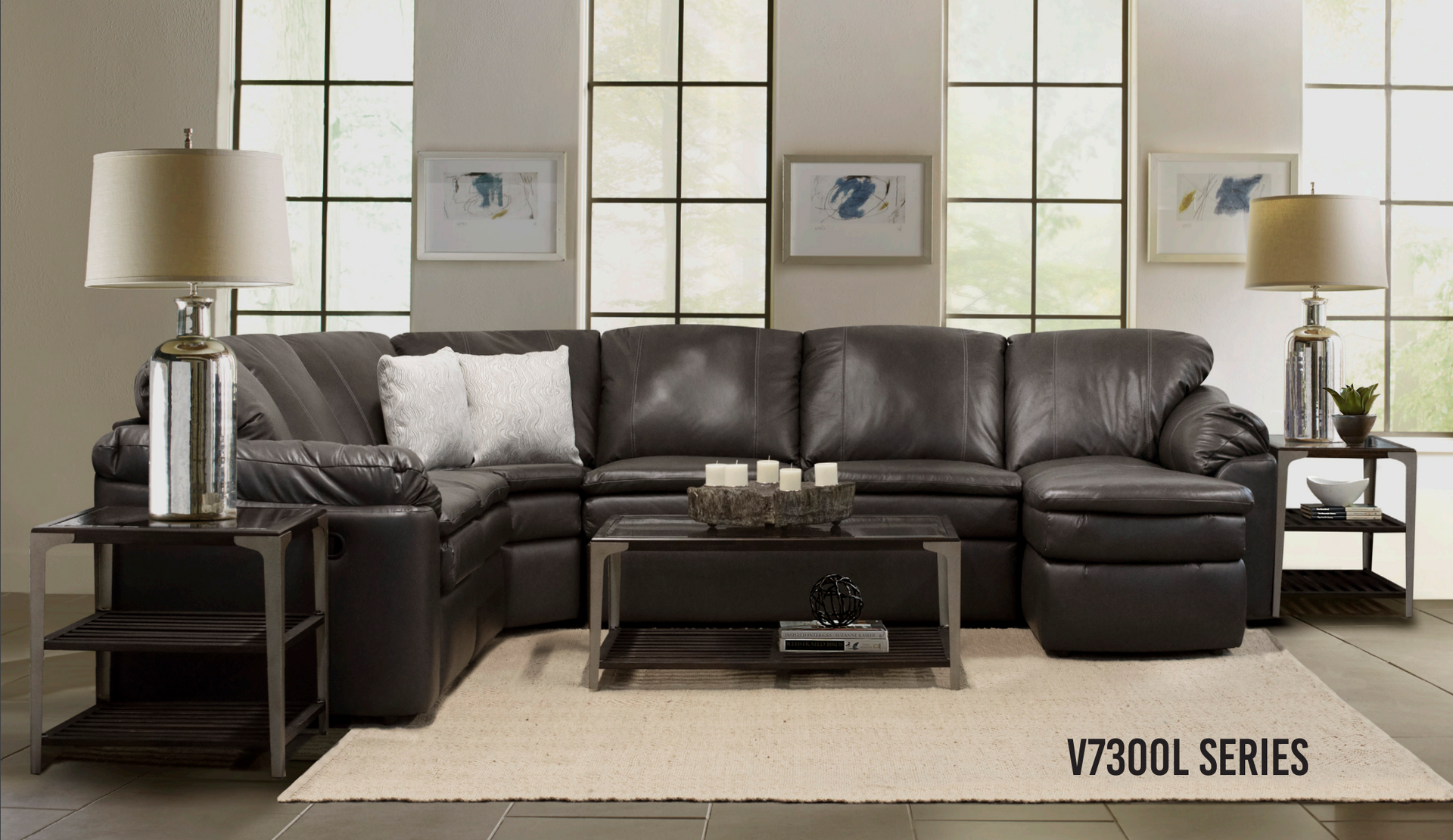 Dark brown leather sectional sofa with two side tables and a coffee table