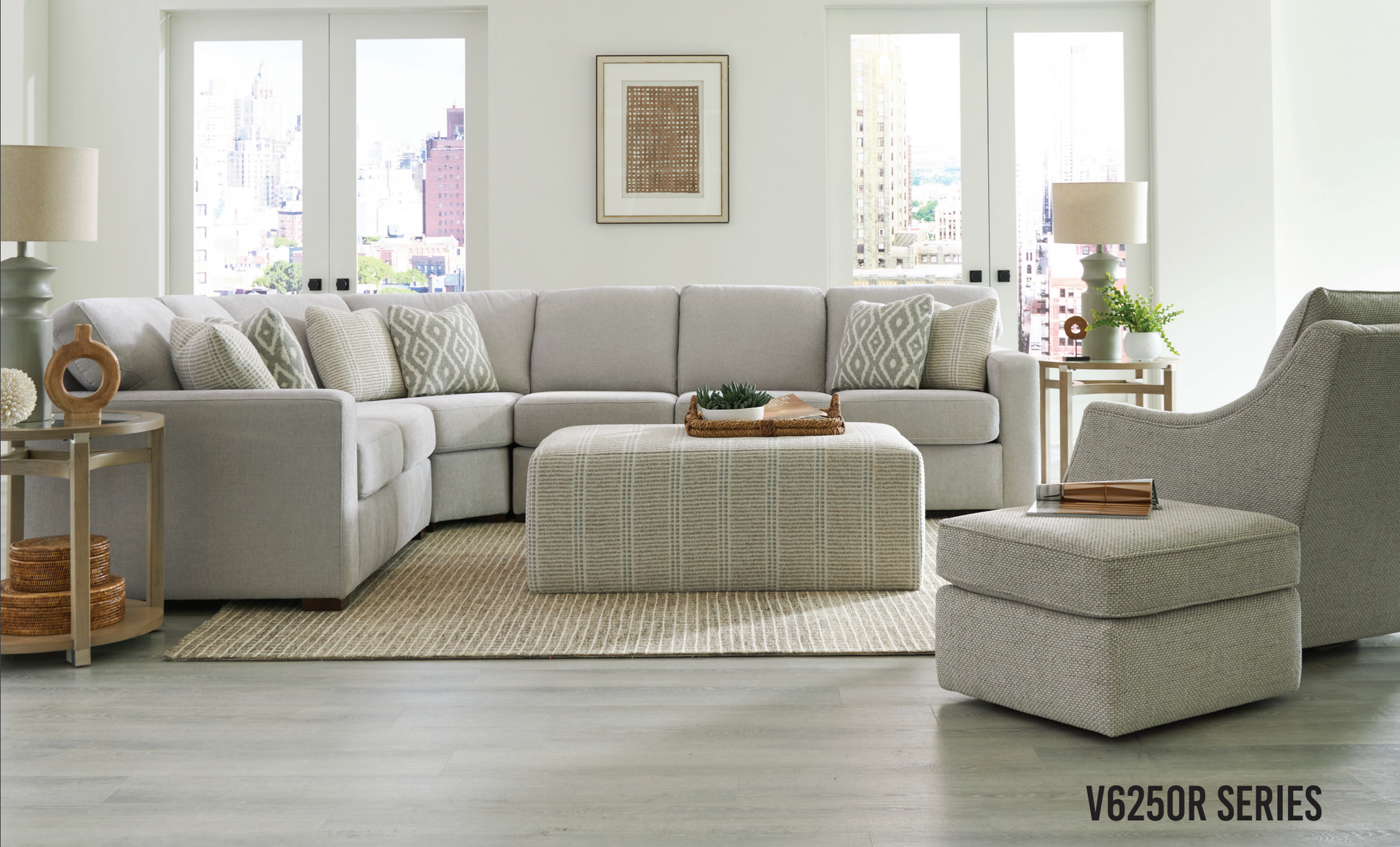 Sectional sofa, chair, ottoman, and decor in a living room; neutral colors.