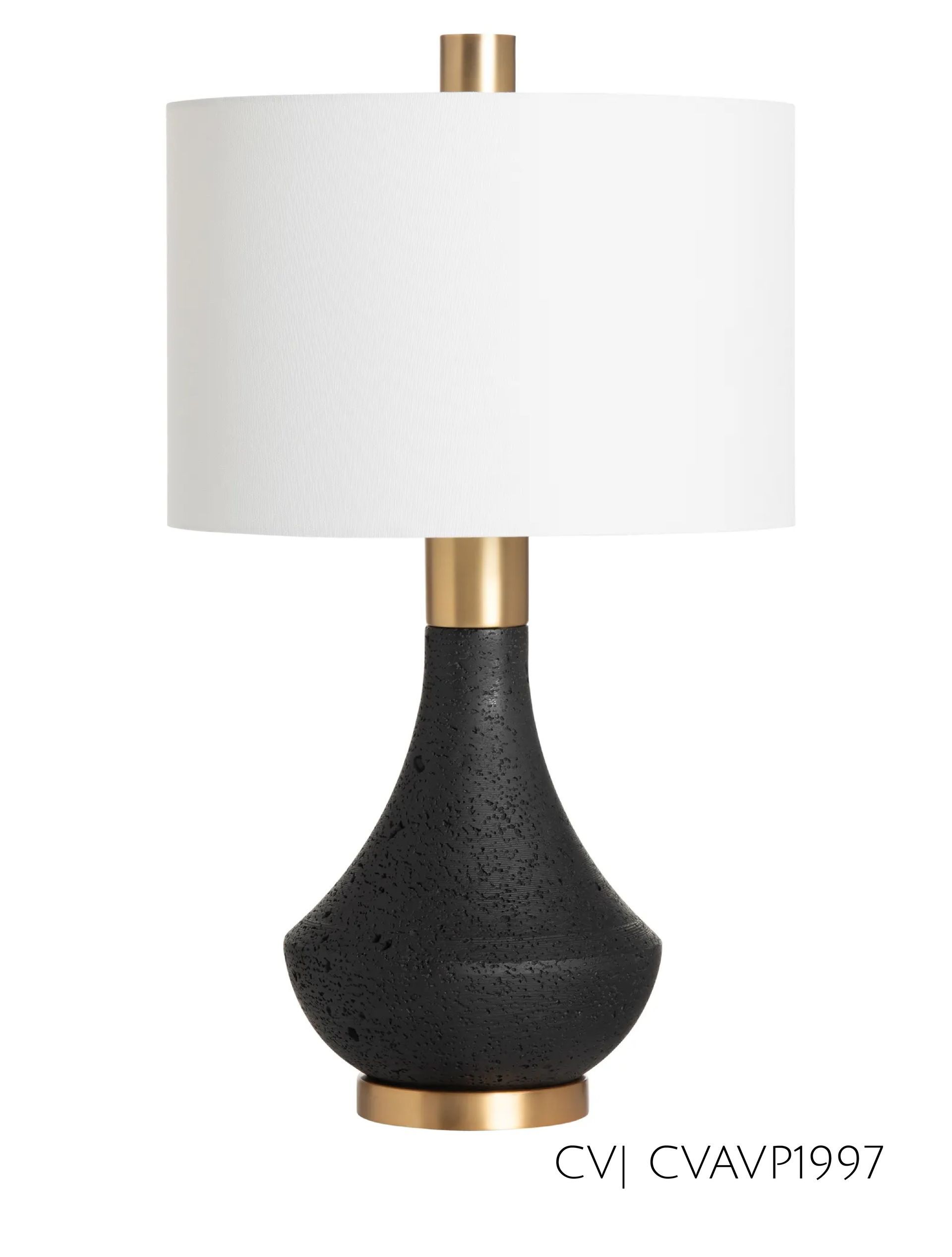 Black table lamp with gold accents and a white drum shade.