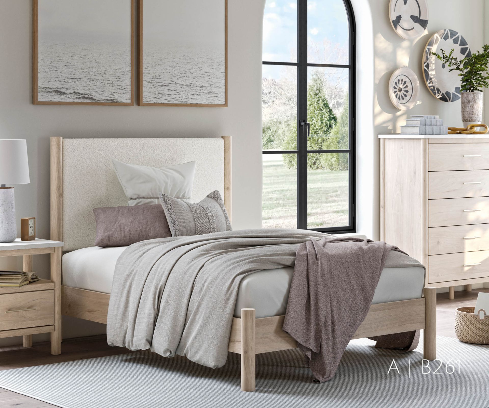 Bedroom with bed, nightstand, dresser, and artwork; neutral tones.