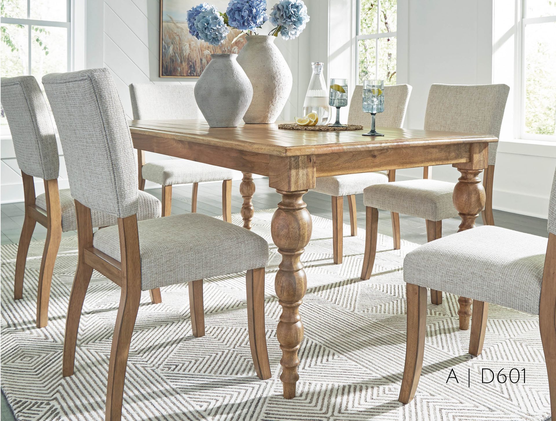 Dining room with a wooden table, chairs, rug