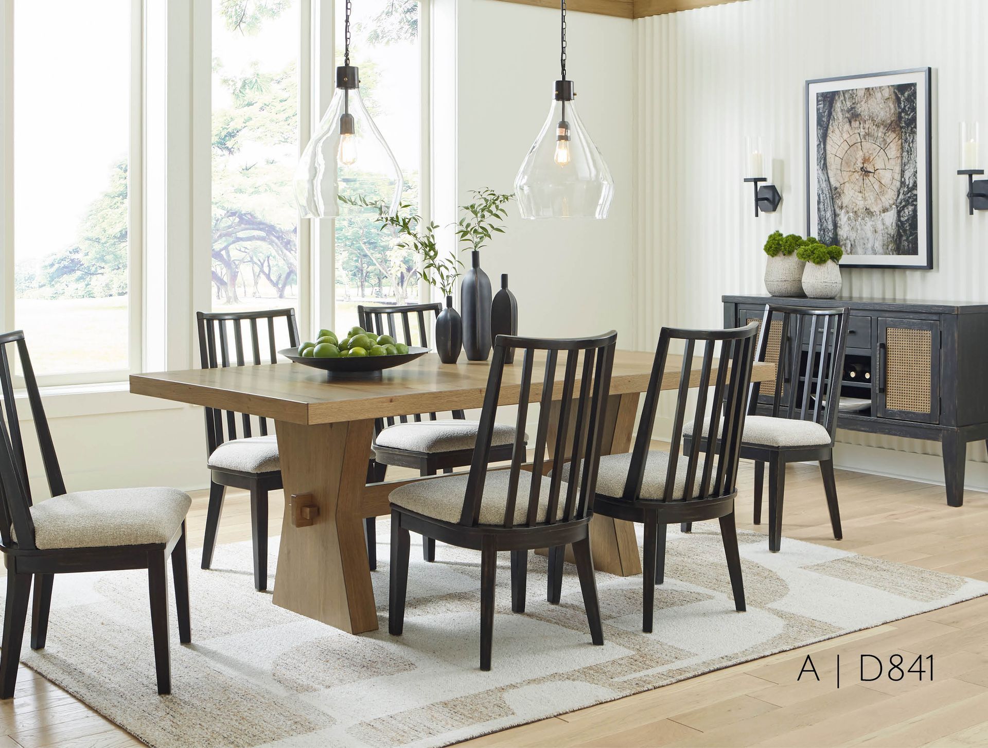 Dining room with wooden table and six black chairs