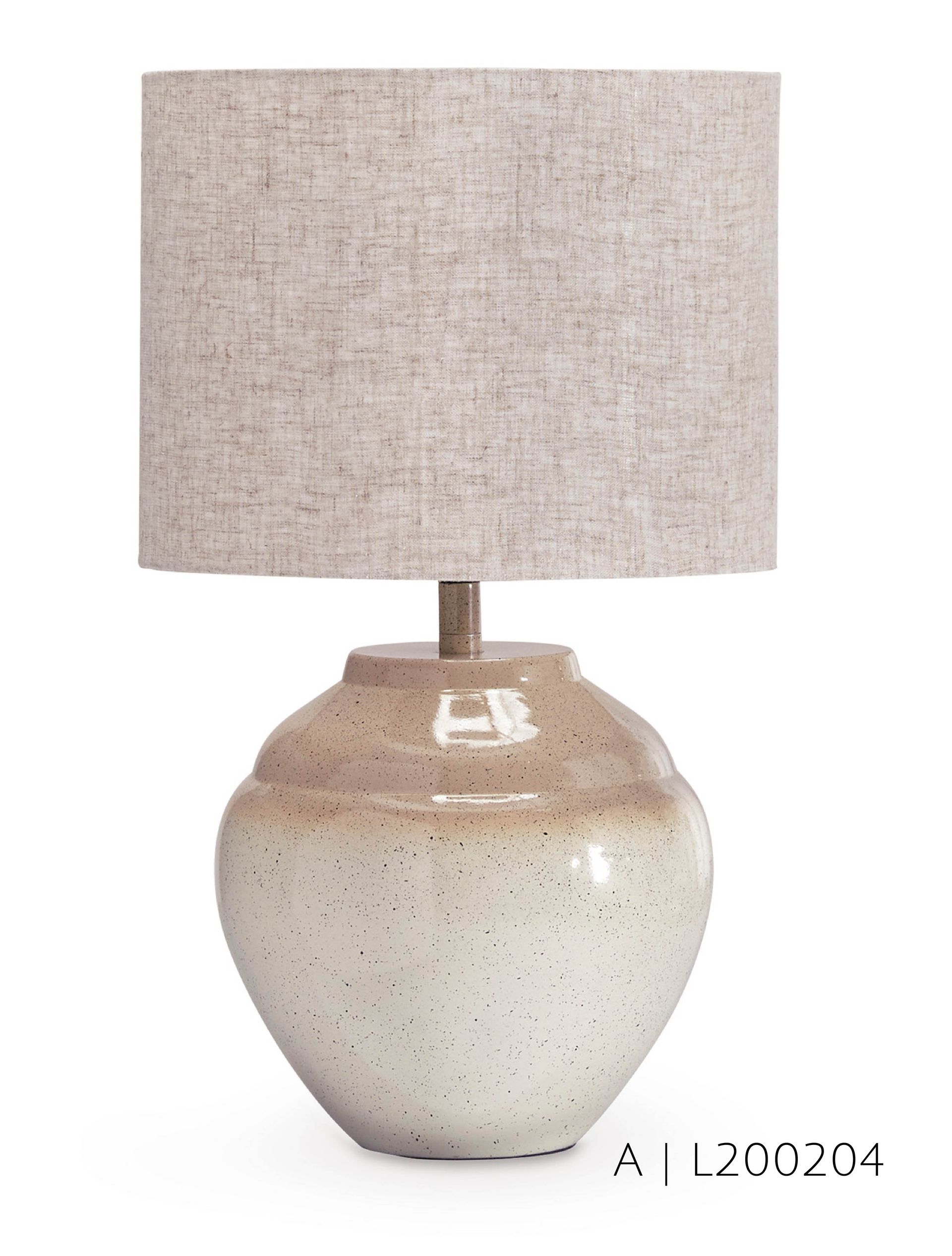 Cream-colored ceramic table lamp with tan speckled base and linen shade.