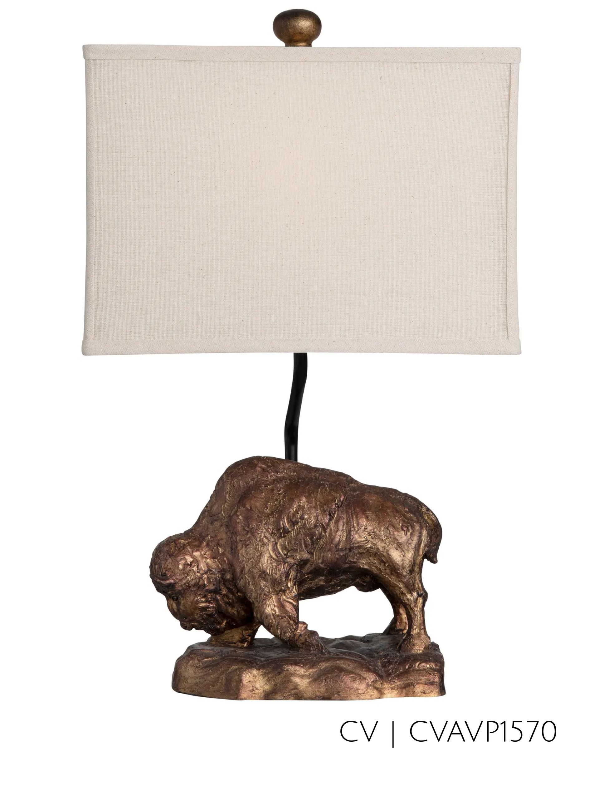 Bronze bison table lamp with beige rectangular shade.