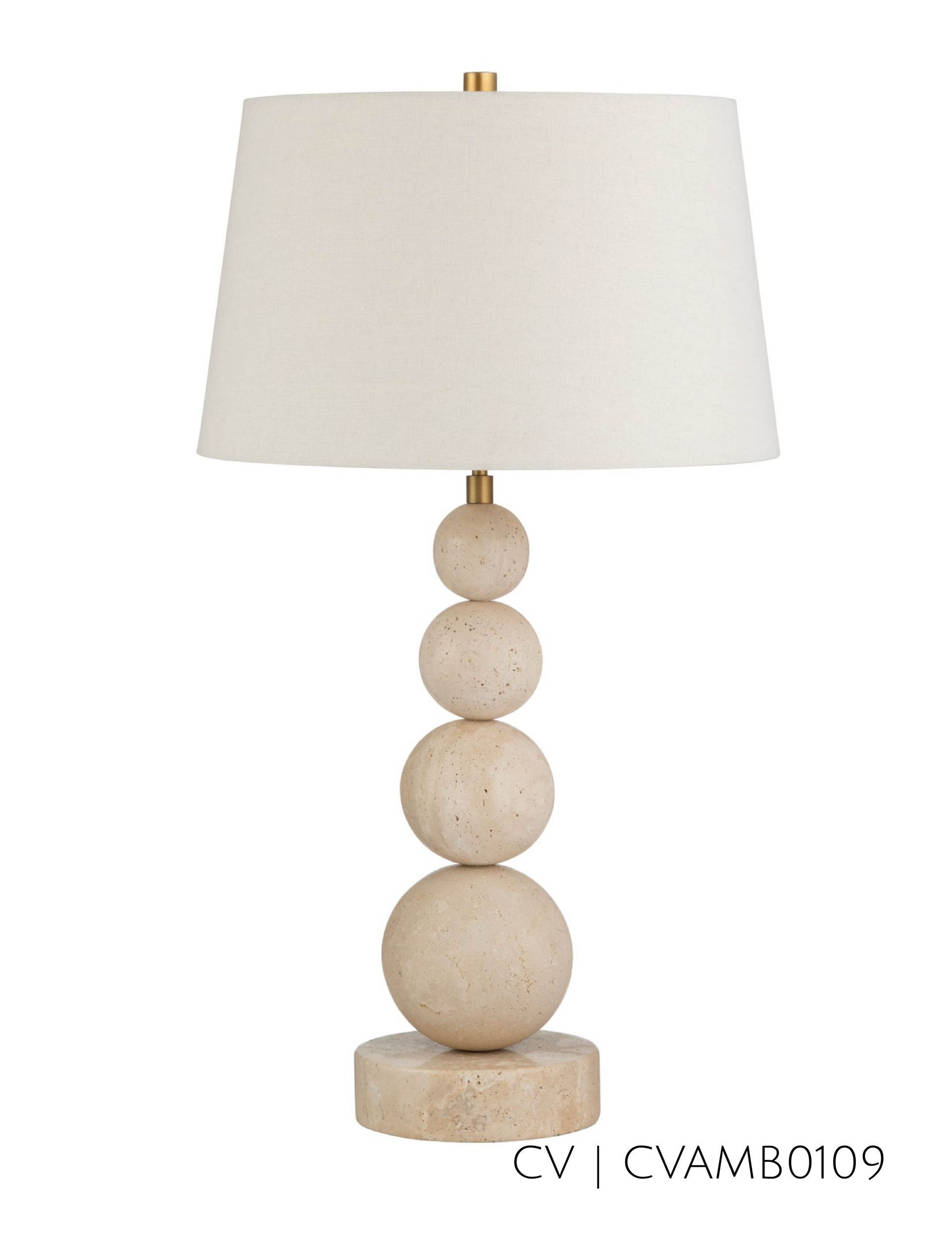 Beige table lamp with stacked sphere base, topped with white shade.