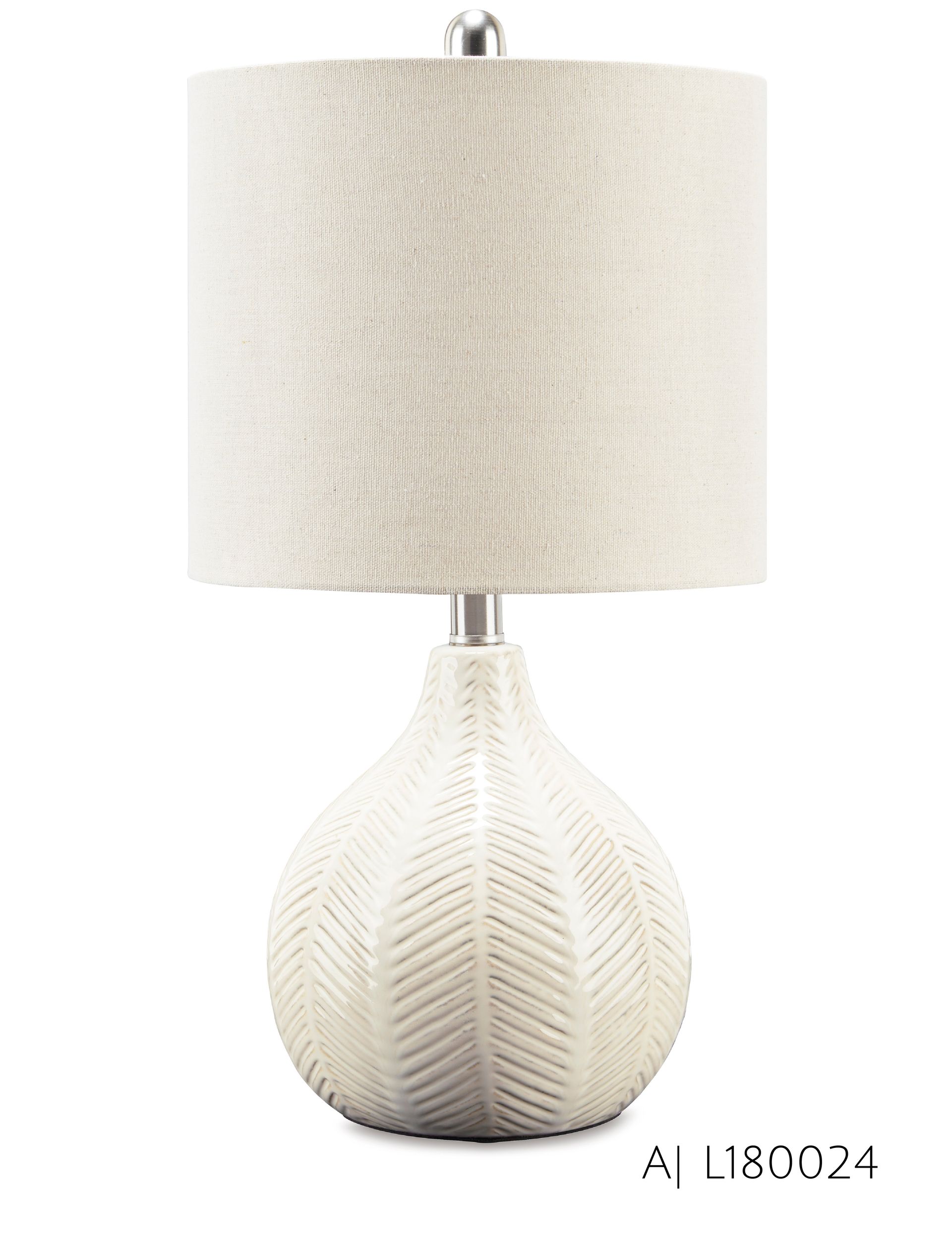 Cream-colored ceramic table lamp with a patterned base and linen shade.